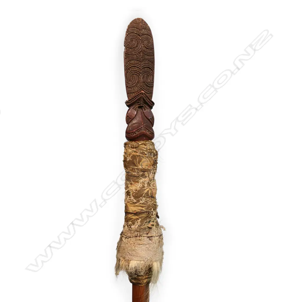A 19thC or earlier Māori carved wooden taiaha with feather and dog hair wrap, Image 1++